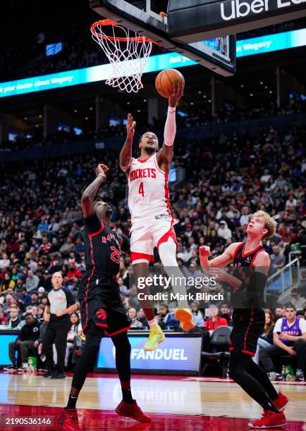 Houston Rockets Toronto Raptors Jalen Green of the Houston Rockets goes to the basket against Gradey ...