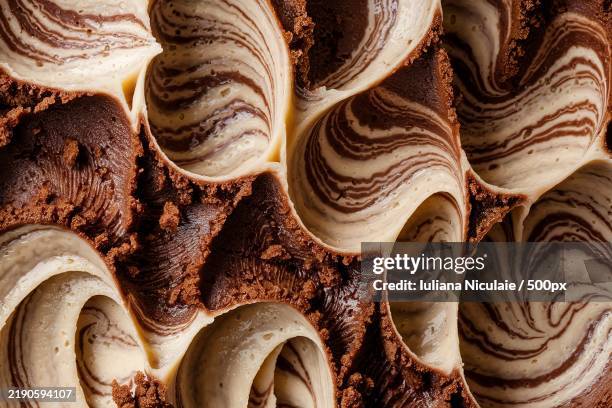 a close-up shot of a brownie frosting texture - brownie cake stock pictures, royalty-free photos & images