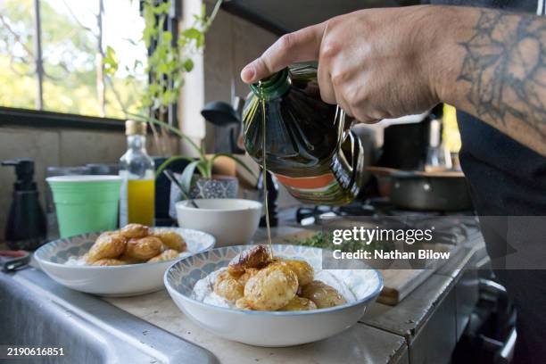 diverse cuisines how we gather bbq - tattoo man cooking stock pictures, royalty-free photos & images