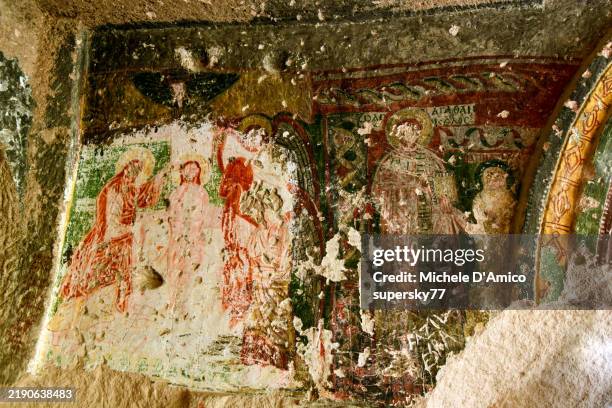 ancient byzantine paintings inside a church in a rock hoodoo - fresco stock pictures, royalty-free photos & images