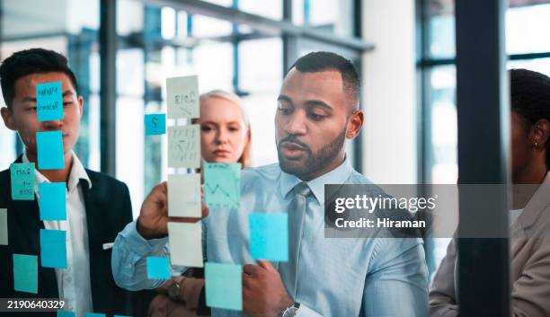 team collaboration during a strategy planning session in a modern office - resourceful stock pictures, royalty-free photos & images
