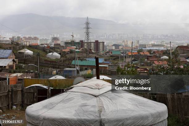 Houses and traditional gers in Ulaanbaatar, Mongolia, on Thursday, Aug. 15, 2024. Swiftly assembled tents traditionally used by Mongolia's...