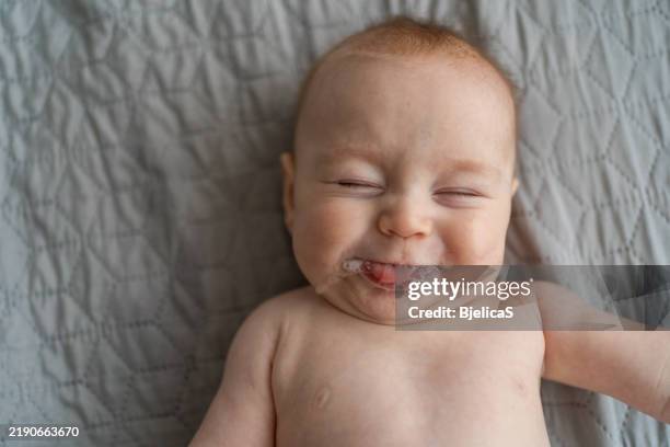 facial expression of cute baby boy - saliva substância orgânica imagens e fotografias de stock