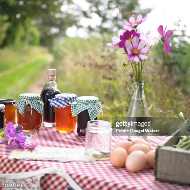 home made produce stall by a country road, uk. - jam jar stock pictures, royalty-free photos & images
