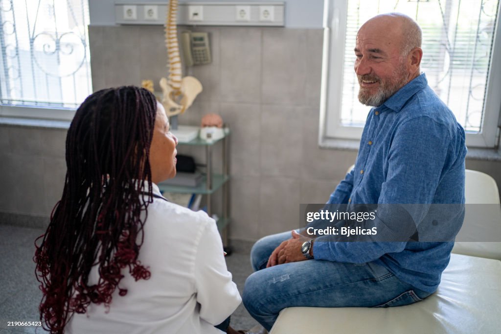 Doctor and patient talking at doctor's office
