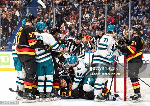 Jan Rutta Jan Rutta of the San Jose Sharks and Teddy Blueger of the Vancouver ...