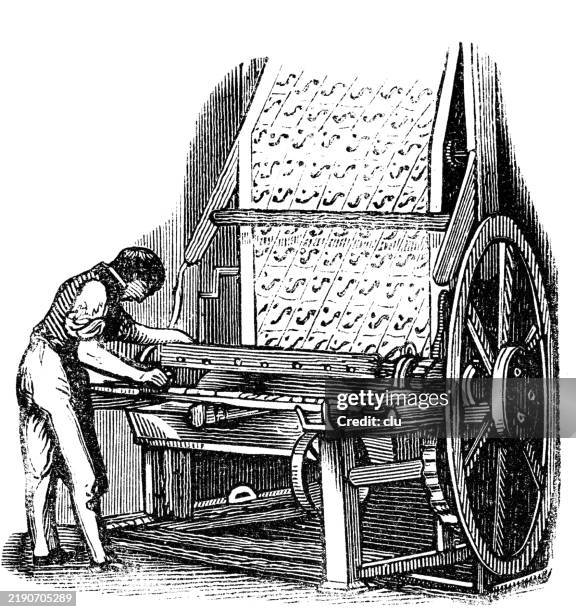 roll printing machine for cotton fabrics - woodcut stock illustrations