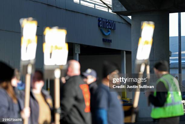 Amazon Teamsters union workers picket outside an Amazon distribution center on December 19, 2024 in San Francisco, California. Thousands of Amazon...
