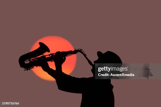 new orleasn, man playing saxaphone - jazz stock pictures, royalty-free photos & images