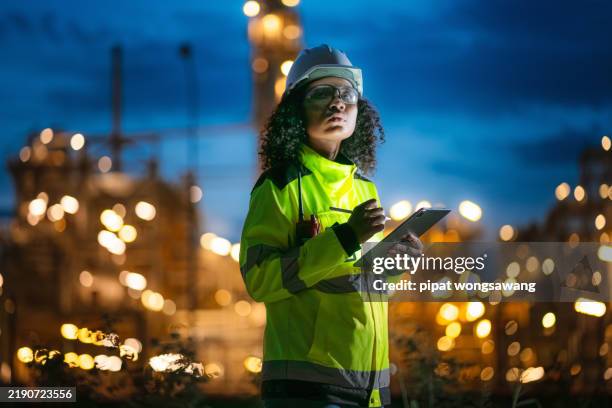 inspection engineers working with laptop of gas refinery plant and refinery oil factory industry at night to inspect the factory production quality, research and development concept of energy production - chemical plant stock pictures, royalty-free photos & images