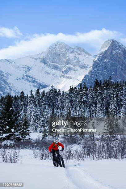 rocky mountain winter fat bike ride - carbon fibre bike stock pictures, royalty-free photos & images