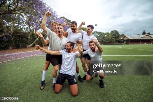 soccer players celebrating goal together - soccer team stock pictures, royalty-free photos & images