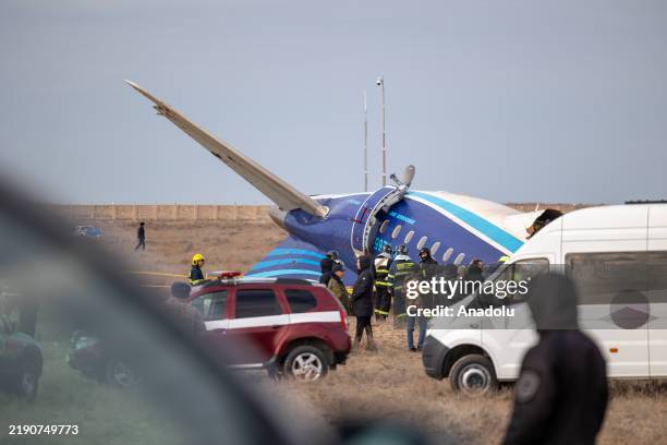 View of the scene after an Azerbaijan Airlines flight with 67 people on board, traveling from the Azerbaijani capital Baku to Grozny in Russia's...