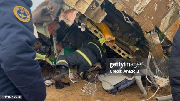 View of the crash site where an Azerbaijan Airlines flight with 67 people on board, traveling from the Azerbaijani capital Baku to Grozny in Russia's...
