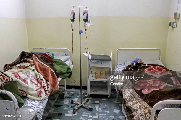 Afghan victims injured in a Pakistani air strike, receive medical treatment at a hospital in Sharan, capital of Paktika province on December 25 a day...