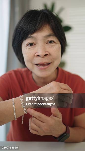 mature woman making a small business online. - streamer stock pictures, royalty-free photos & images
