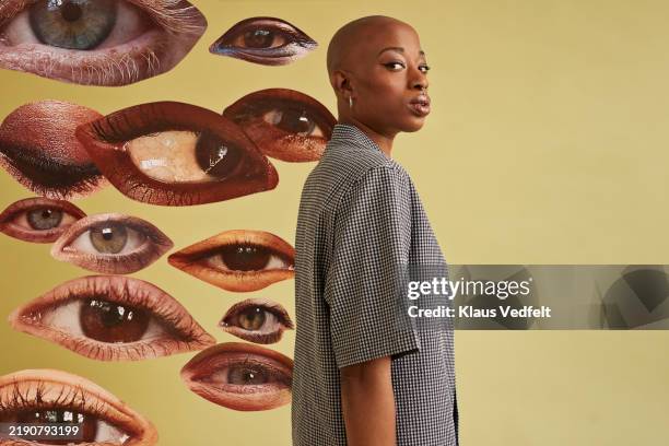 non-binary person by eyes cut outs - gesundheitsüberwachung stock-fotos und bilder