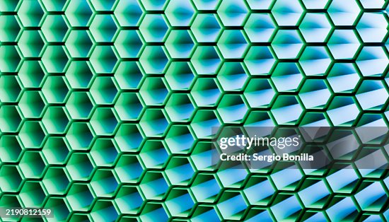 Hexagonal mesh pattern with a turquoise and blue gradient background Hexagonal mesh pattern with a turquoise and blue gradient background