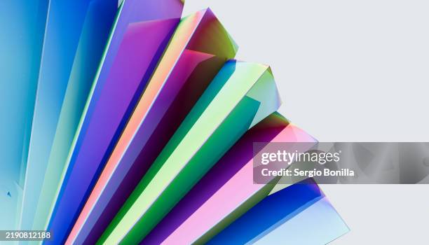 A Stack Of Colorful Paper Fans Displayed Against A Light Blue ...