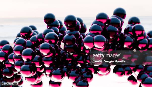 abstract spheres art installation on a beach at dawn - appliance installation stock illustrations