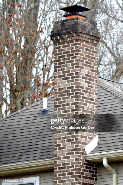 brick chimney - brick chimney stock pictures, royalty-free photos & images