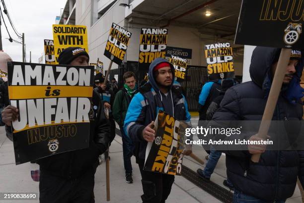 Amazon workers organized by the Teamsters Union go on strike and walk a picket line in front of the DBK4 Amazon facility on December 20, 2024 in the...