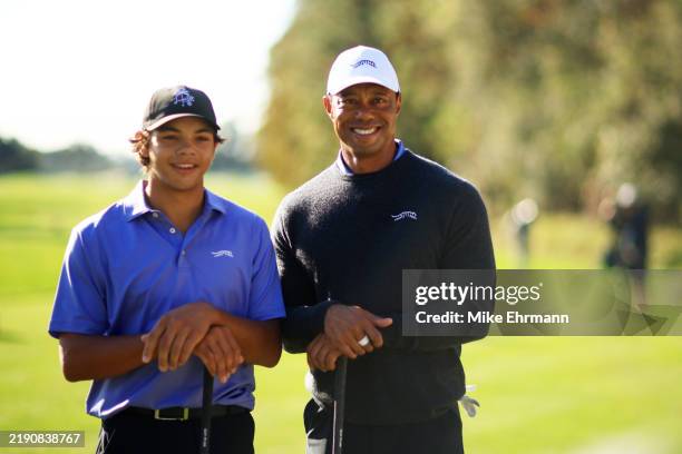 Tiger Woods of the United States and son Charlie Woods pose for a photo during the pro-am prior to the PNC Championship at Ritz-Carlton Golf Club on...