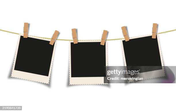 ilustrações de stock, clip art, desenhos animados e ícones de photograph frames hanging on a string - mola de roupa
