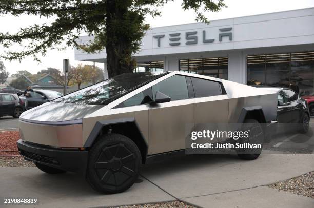 Tesla Cybertruck is displayed at a Tesla dealership on December 20, 2024 in Corte Madera, California. Electric car maker Tesla is recalling 700,000...