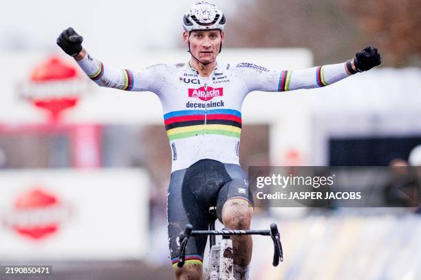 Dutch rider Mathieu Van Der Poel celebrates as he crosses the finish line to win the Men's UCI Cyclocross World Cup elite race in Gavere, northern...