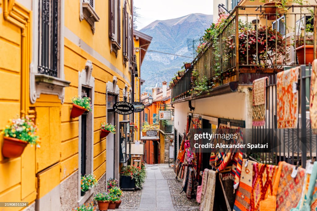 Colorful alley with artisanal shops and galleries in Bellagio town, Lake Como, Lombardy, Italy