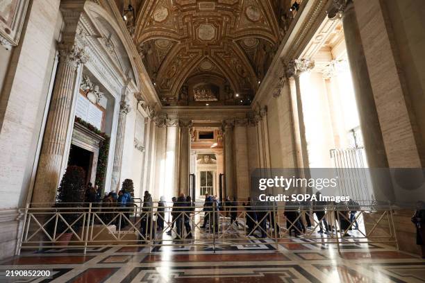 Pilgrims from all over the world perform the ritual of crossing the Holy Door on the first day of opening it by Pope Francis, in St. Peter's Basilica...