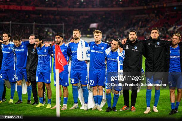Magdeburg players stand together with their fans during the Second Bundesliga match between Fortuna Düsseldorf and 1. FC Magdeburg at Merkur...