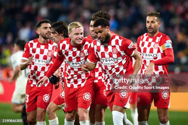 Arnaut Danjuma of Girona FC celebrates after scoring their side's third goal with his teammates during the LaLiga match between Girona FC and Real...