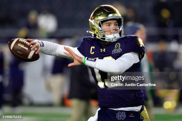 Riley Leonard of the Notre Dame Fighting Irish warms up prior to the Playoff First Round game against the Indiana Hoosiers at Notre Dame Stadium on...
