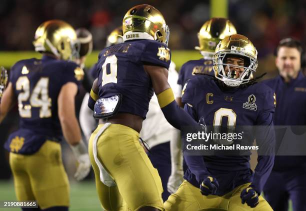 Deion Colzie of the Notre Dame Fighting Irish celebrates with teammates after making an interception during the first quarter against the Indiana...