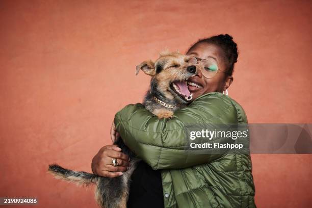 portrait of woman with her pet dog. - pet owner stock pictures, royalty-free photos & images
