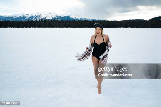 barefoot running across snow, canada - barefoot snow stock pictures, royalty-free photos & images