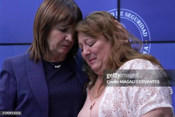Griselda Heredia , mother of Nahuel Agustin Gallo, a member of the Argentine Gendarmerie detained in Venezuela, is comforted by Argentina's Security...
