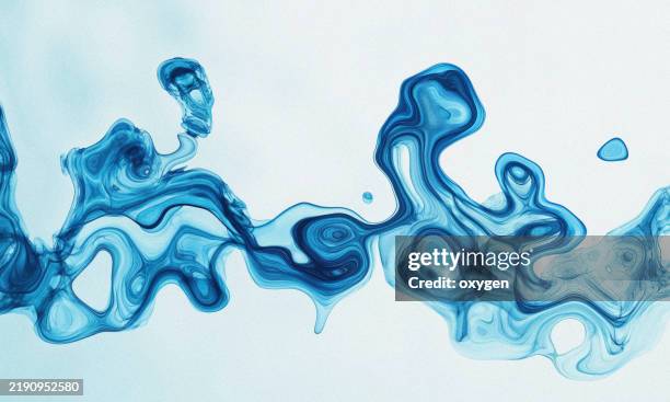 abstract blue fluid amoeba shapes on white background. organic fluid shapes in vivid blue tones flowing on a clean white background. - reazione chimica foto e immagini stock