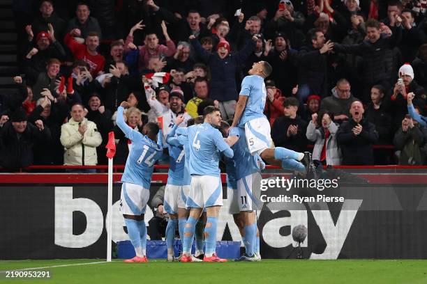 Anthony Elanga of Nottingham Forest celebrates scoring his team's second goal with teammates during the Premier League match between Brentford FC and...
