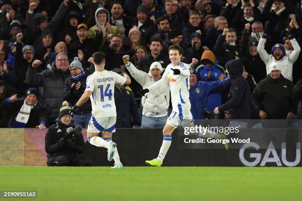 Brenden Aaronson of Leeds United celebrates scoring his team's third goal with teammate Manor Solomon during the Sky Bet Championship match between...