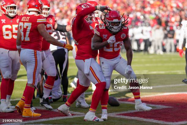 Kareem Hunt of the Kansas City Chiefs celebrates after a rushing touchdown in the second quarter of a game against the Houston Texans at GEHA Field...