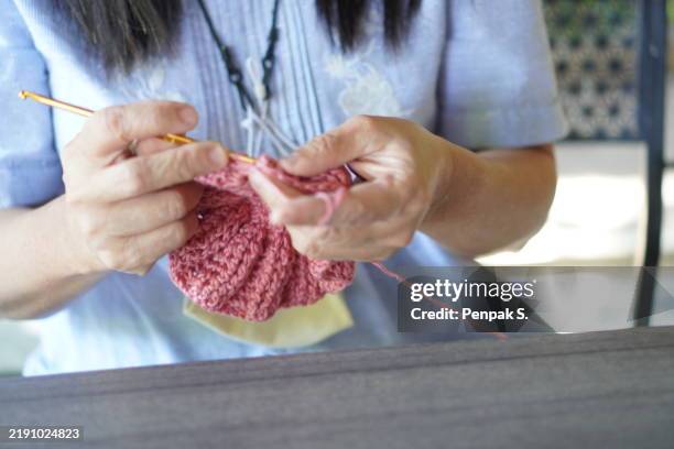woman knitting yarn hat - crochet stock pictures, royalty-free photos & images