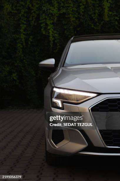 audi a3 sedan , 2024 model , close-up of headlight , stock photo - luxeauto stockfoto's en -beelden