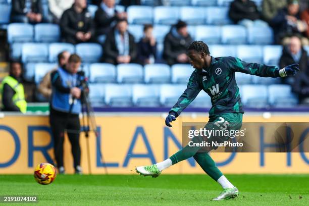 Romain Esse of Millwall warms up during the Sky Bet Championship match between Coventry City and Millwall at the Coventry Building Society Arena in...