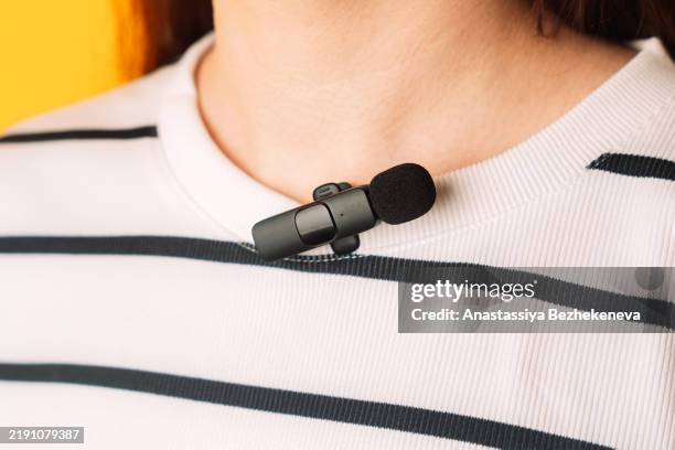 wireless lavalier microphone attached to jacket - lapel stock pictures, royalty-free photos & images