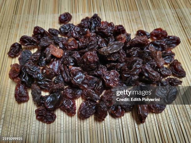 black raisins - raisin stock pictures, royalty-free photos & images