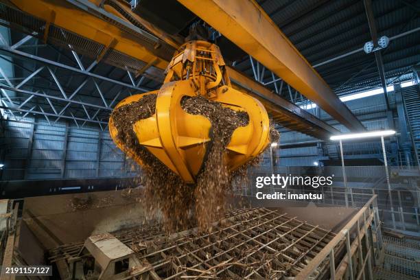 biofuel boiler house, storage of wood chips - wood chip stock pictures, royalty-free photos & images