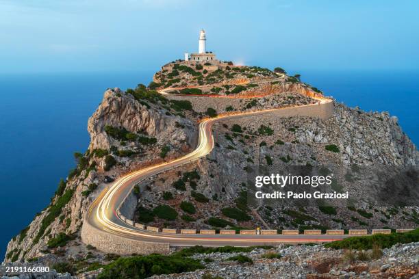 car trails lights on winding road, mallorca island, spain - majorca stock pictures, royalty-free photos & images
